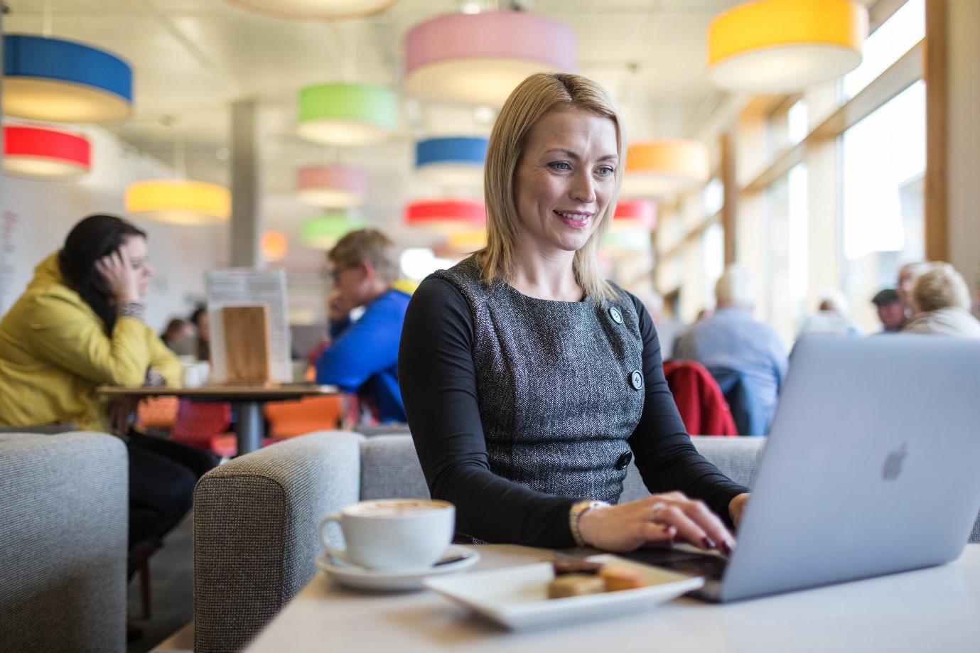 Woman sitting with laptop