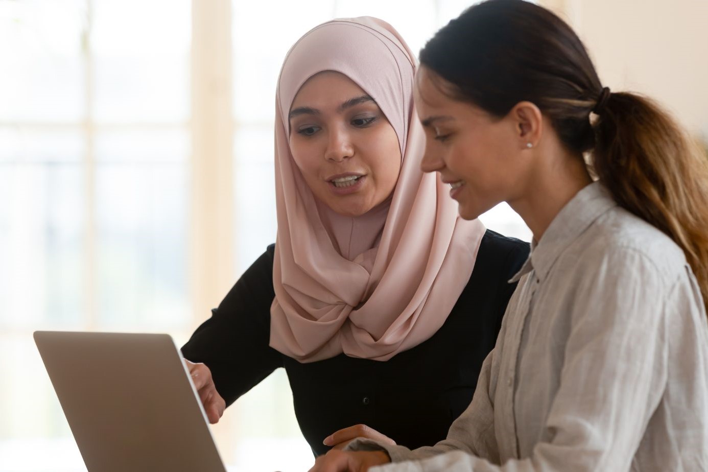 Woman sitting with laptop